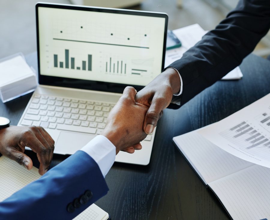 Partners Shaking Hands in Meeting